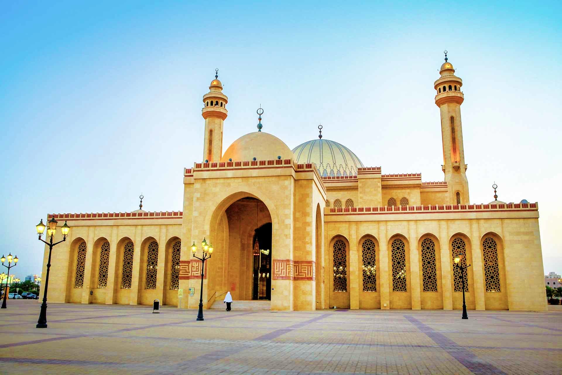 Bahrain Visa Al-Fateh Grand Mosque in Manama, Bahrain, featuring golden domes, minarets, and Islamic architecture against clear blue sky